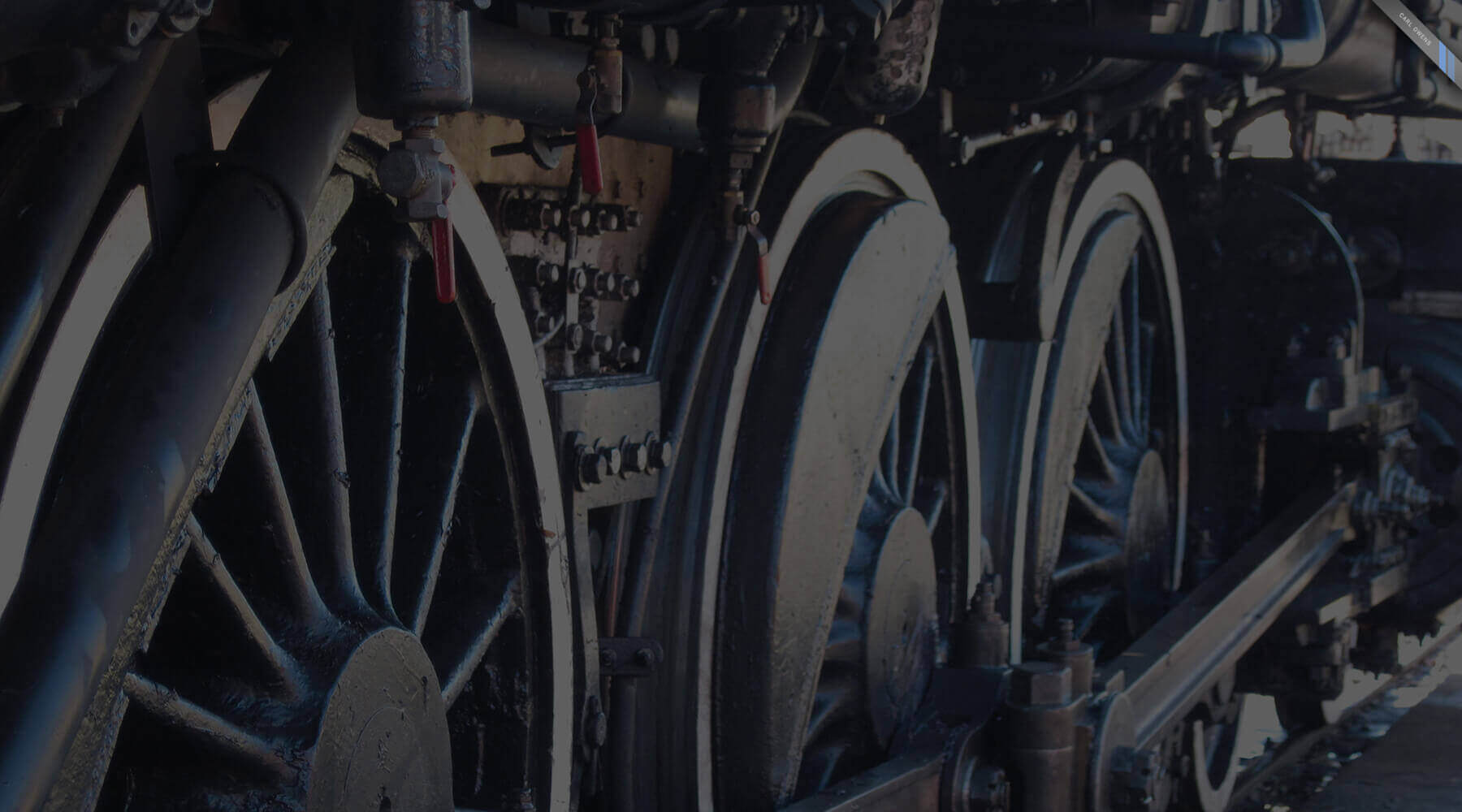photo of large driver wheels on an old American steam engine